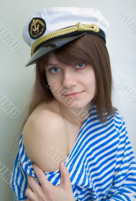 Beautiful girl in a stripped vest and cap
