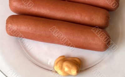 Sausages on a plate.