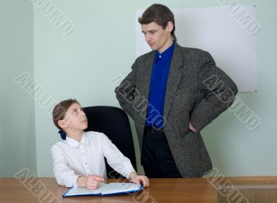 Teacher and schoolgirl with book