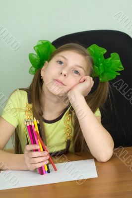 Girl with color pencils in hands