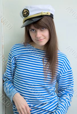 Girl in a cap and a stripped vest
