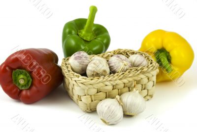 Bell peppers and basket with garlics