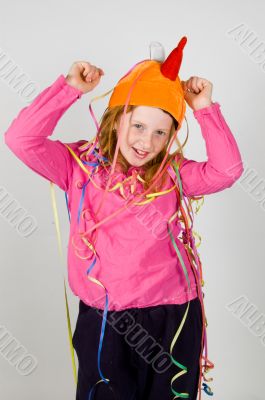 cheerfull happy young girl decorated with colorful confetti