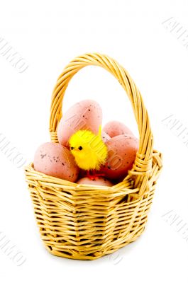 small basket with eggs and a eastern chicken