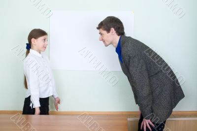 Tutor explains something to the girl