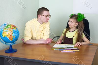 Girl and brother with color pencils
