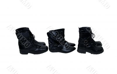 Several black leather boots