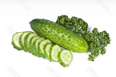 Cutted cucumbers and parsley, healthy food isolated on white