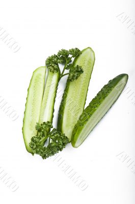 Cutted cucumbers and parsley, healthy food isolated on white