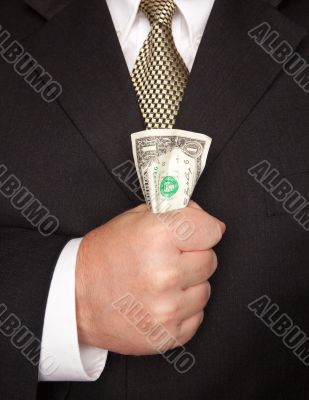 Businessman Squeezing Dollar Bill