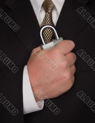 Businessman Holding Large Lock