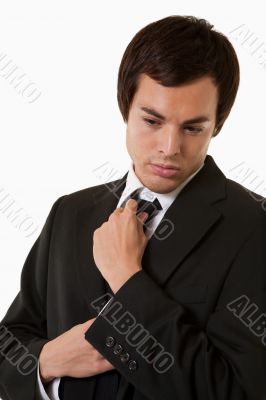 Man fixing tie