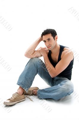 Handsome guy sitting on floor