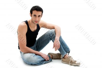 Handsome guy sitting on floor