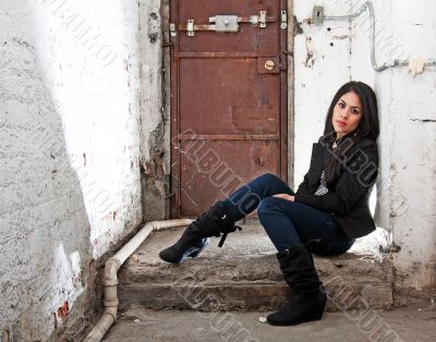 Girl sitting in basement