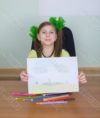 Smiling girl shows new drawing to us