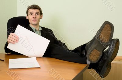Director on a workplace with a graph