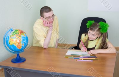 Girl and brother with color pencils