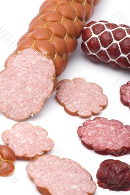 Cutting sausage on white background