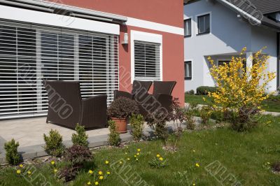 Garden armchair in front of house