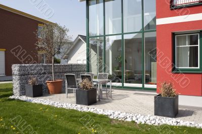 Garden armchair in front of house