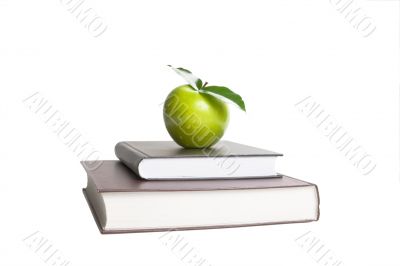 Books and green apple