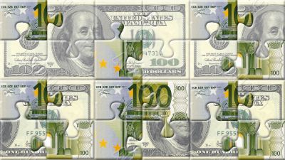 Euro and dollar puzzle pieces