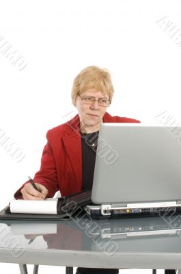 succesfull businesswoman is looking at her finance stats with a
