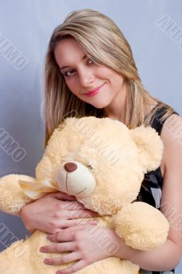 blonde girl with teddy bear
