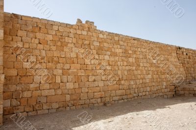 Ancient yellow stone wall