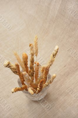 Breadsticks with wheatears in vase