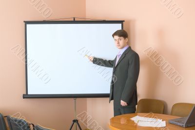 Businessman near the white screen