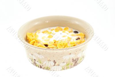 cornflakes with milk in a cup