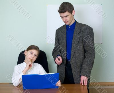 Teacher and schoolgirl with book
