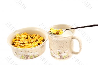 cornflakes with milk in a cup