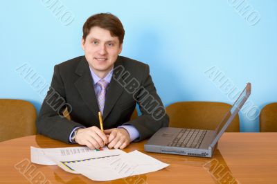 Businessman at a table with laptop