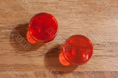Two glasses with jelly, oak floor two