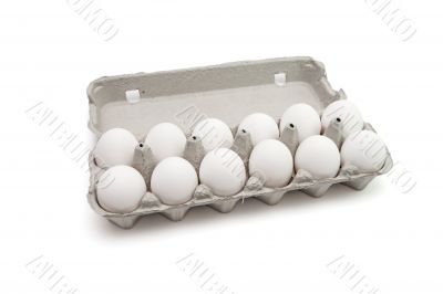 Twelve eggs in a paper box isolated