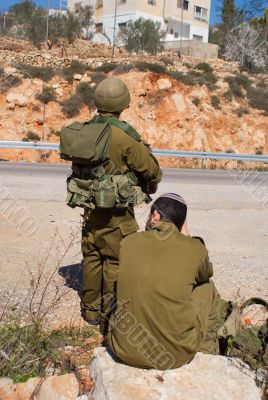 Israeli soldiers patrol in palestinian village