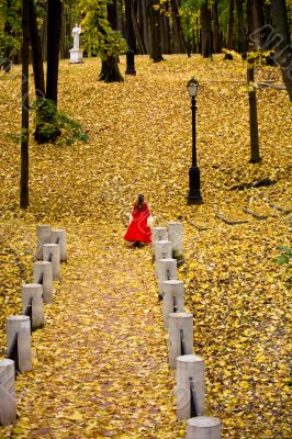 Lady in autumn forest