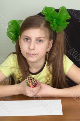 Girl with color pencils in hands