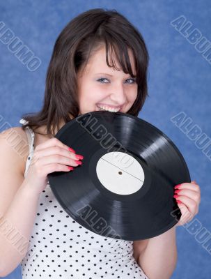 Young woman and vinyl record