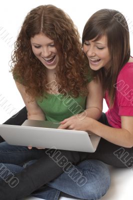 lucky teenagers with laptop