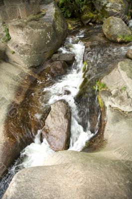 water falling between rocks