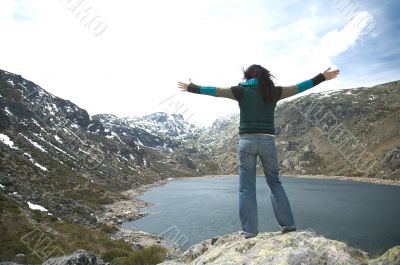 woman greeting mountains