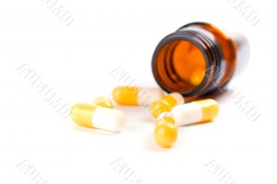 bottle with yelllow capsules