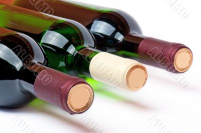 Three bottles with red and white wine