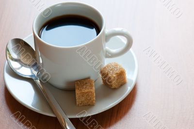 Cup of coffee and reed sugar