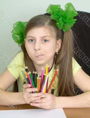 Girl with color pencils in hands