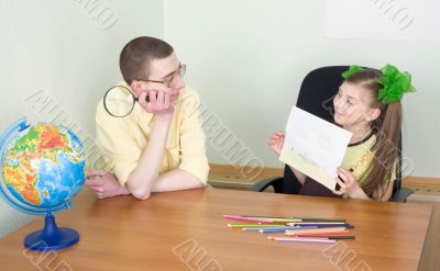 Girl shows new drawing to the brother